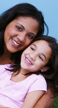 smiling mother and daughter