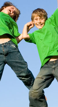 smiling boys jumping